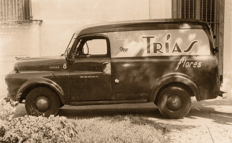 One of our earliest delivery vans, painted with the Trias insignia, from the early 20th century