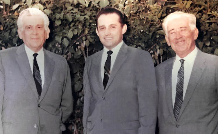 Joaquin and two forefathers, dressed in business suits, circa 1967