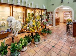 A wide range of colorful floral arrangements, awaiting their new home